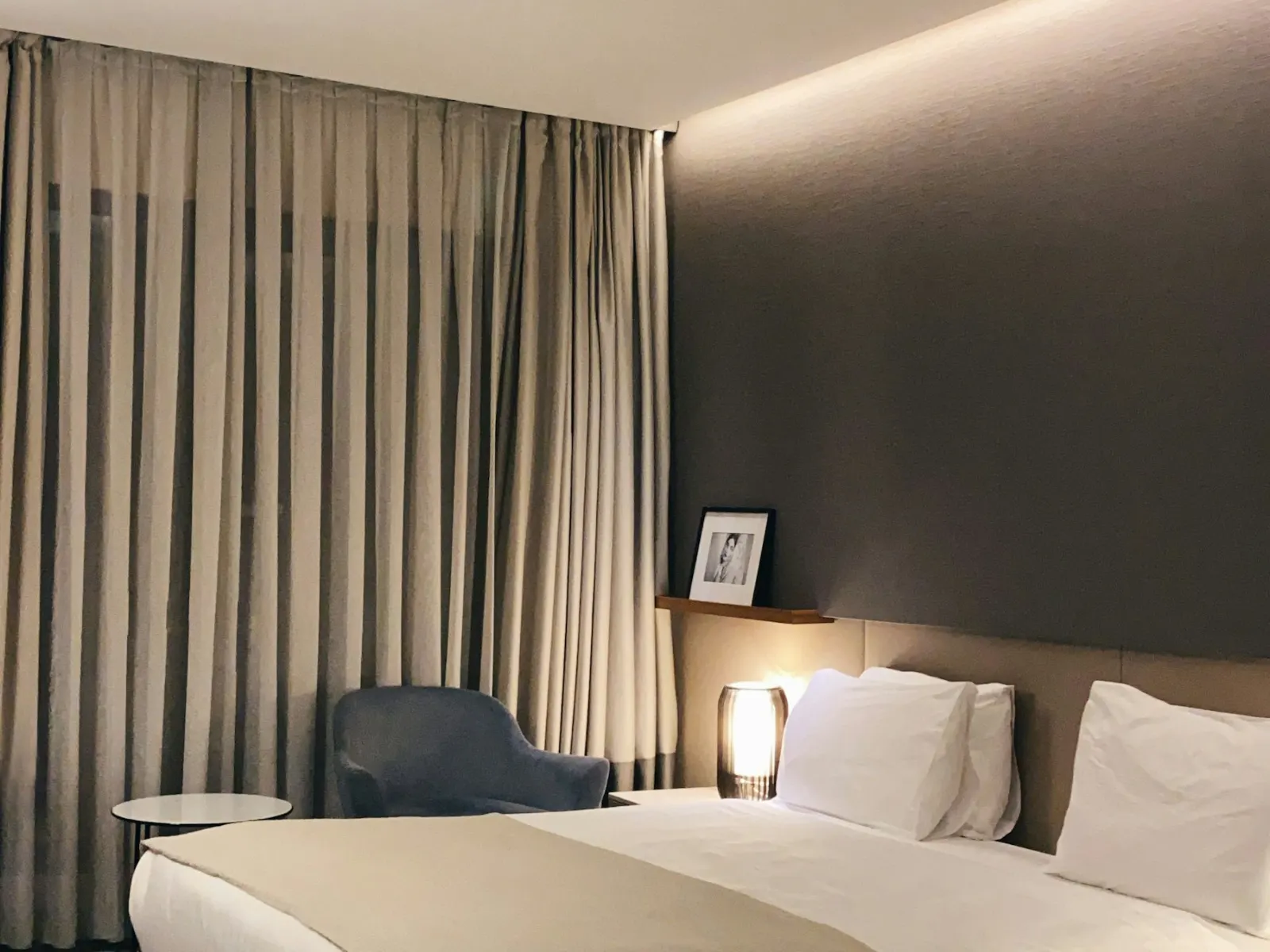 Hotel bed with white linen